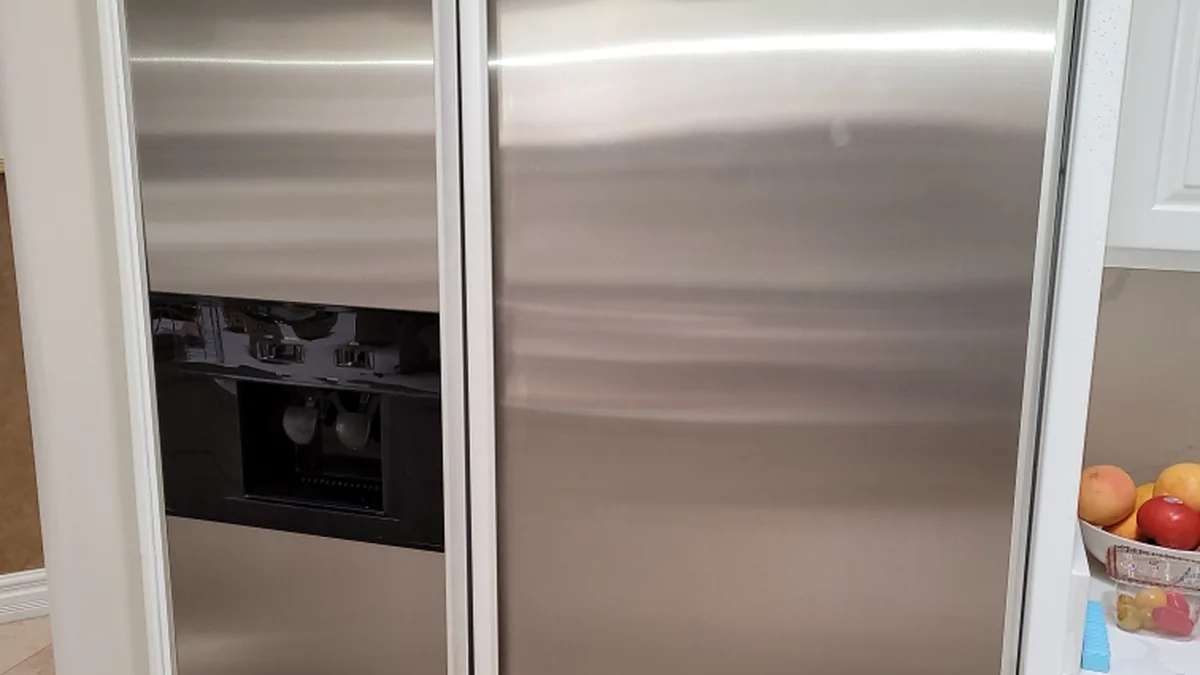 Factory-certified appliance repair technician servicing luxury refrigeration, laundry suites, and cooking ranges in Palo Alto, CA